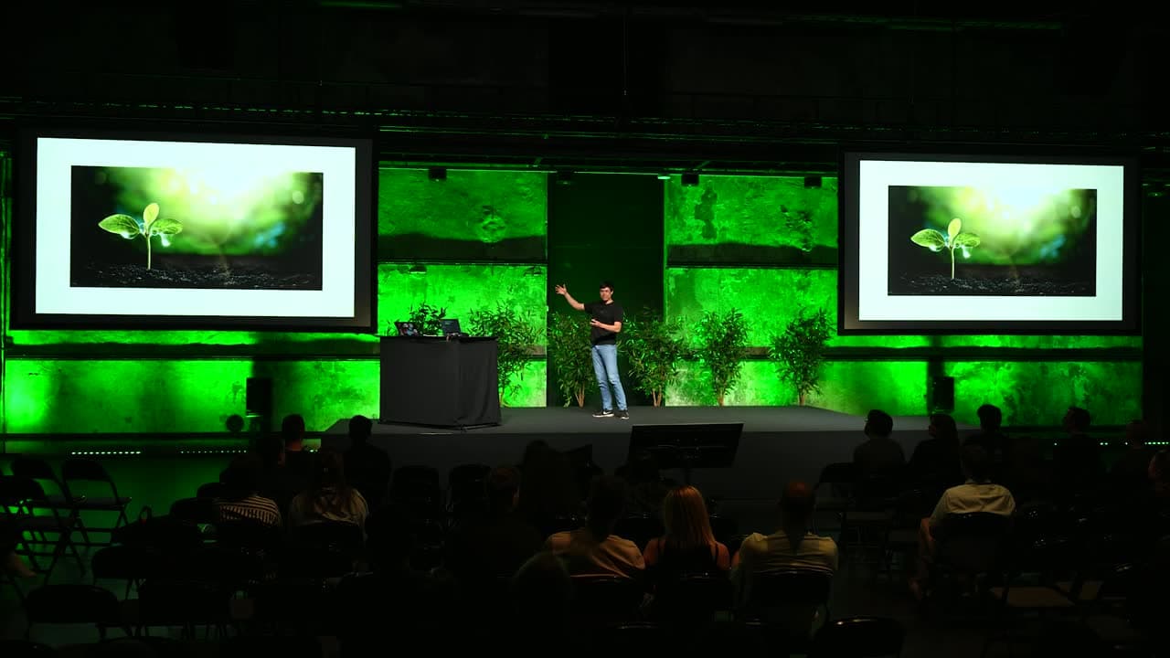 Jonas Hulthén speaking on stage